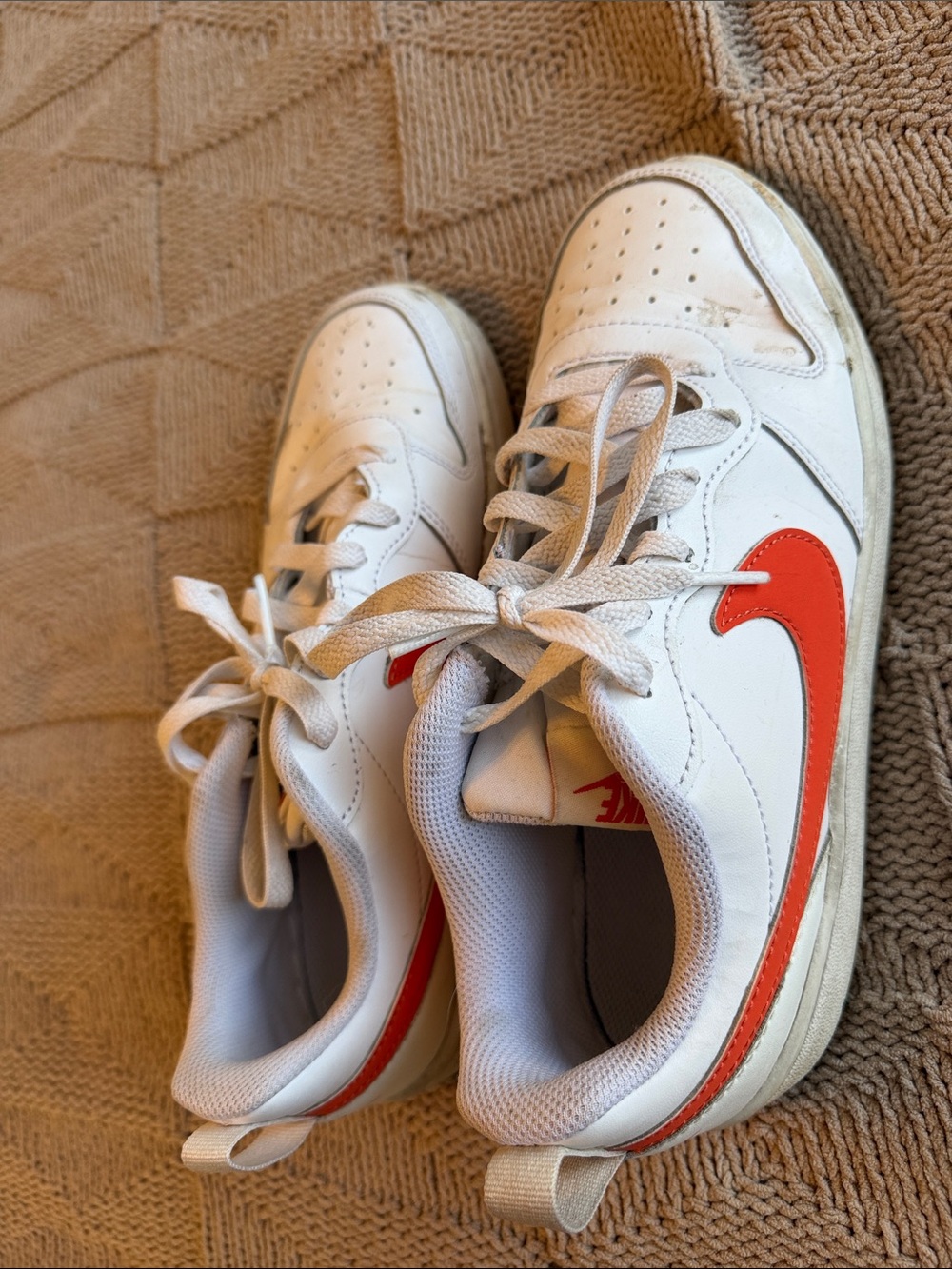 Nike Kids White Sneakers with Orange Swoosh Accent